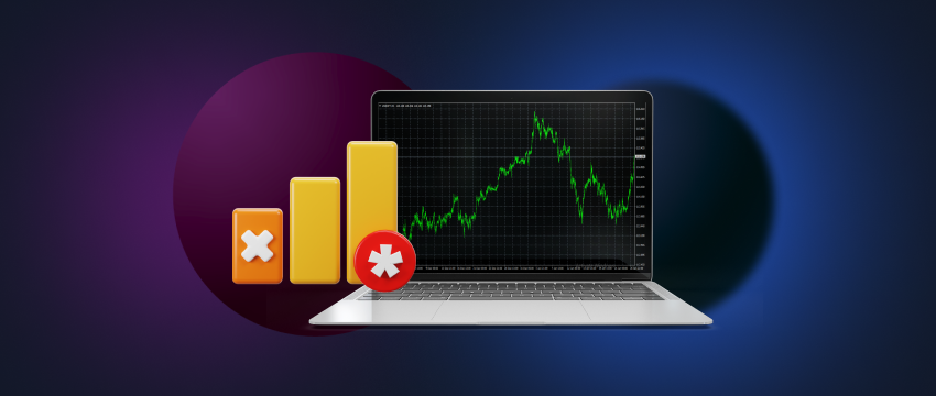 A person using a laptop and a mobile phone to trade forex, analyzing charts on the screens.