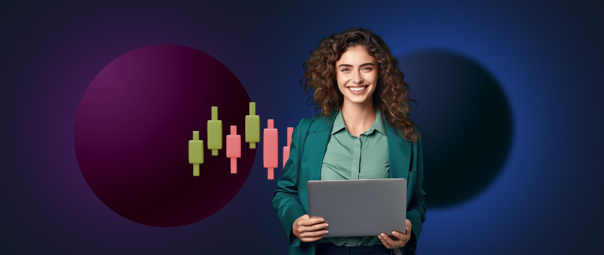 A woman, a forex trader, holds a laptop while studying a financial chart.