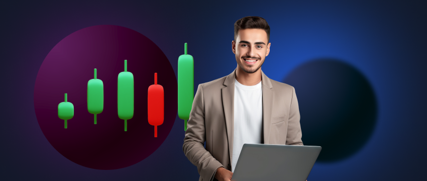 A man holds a laptop while standing in front of a chart, illustrating the sentiment of traders in the market.