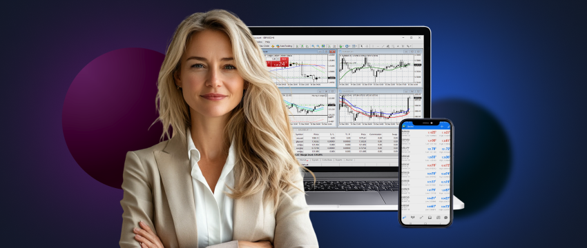 A woman with her arms crossed, looking at a laptop and phone, representing a trading environment.